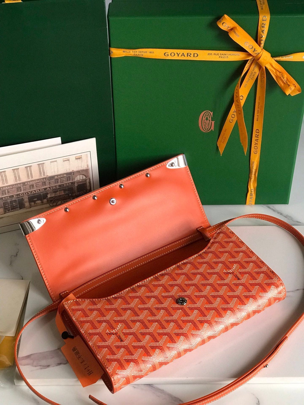 MONTE-CARLO PM CLUTCH 25 IN ORANGE GOYARDINE CANVAS