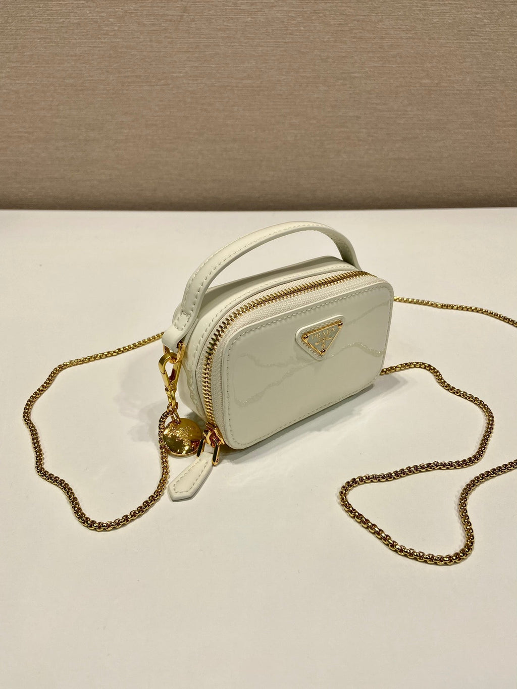 MINI HAND BAG 11 WITH GOLD STRAP IN WHITE PATENT CALFSKIN