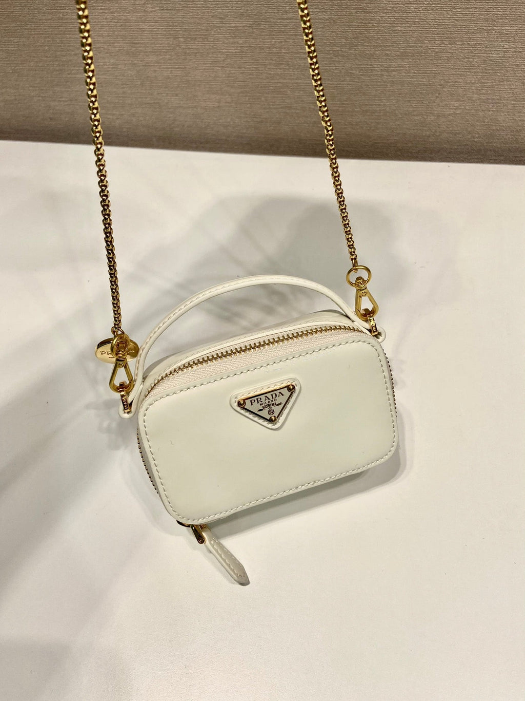 MINI HAND BAG 11 WITH GOLD STRAP IN WHITE PATENT CALFSKIN