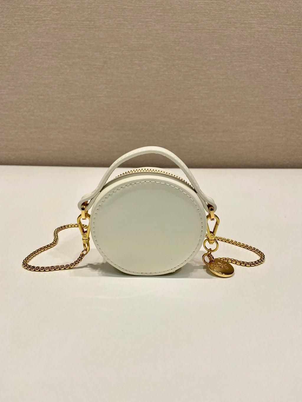 MINI ROUND BAG 8 IN WHITE GLOSSY CALFSKIN GOLD HARDWARE