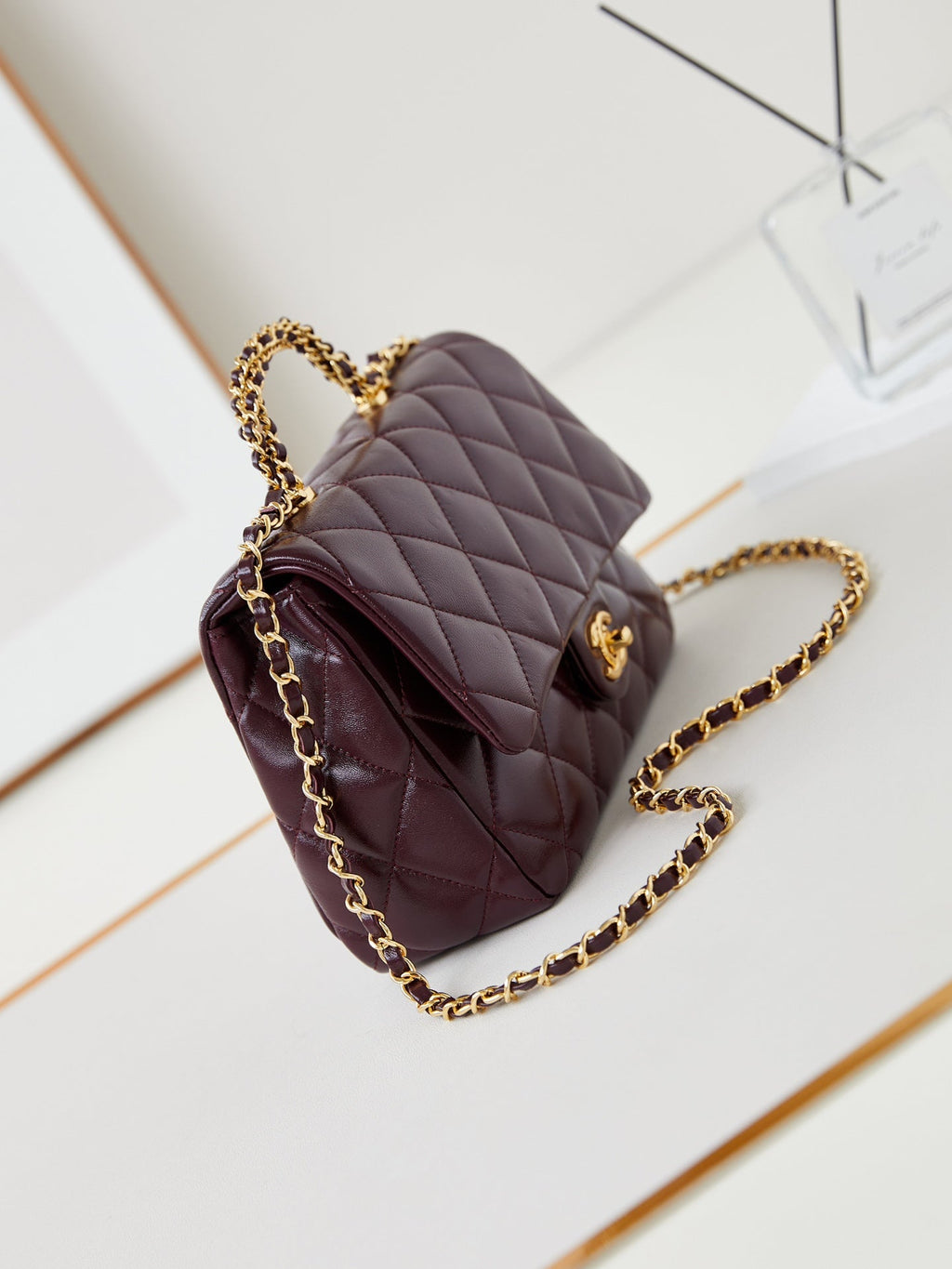 FLAP BAG WITH TOP HANDLE 25 IN WINE RED OIL-WAX LAMBSKIN GOLD HARDWARE