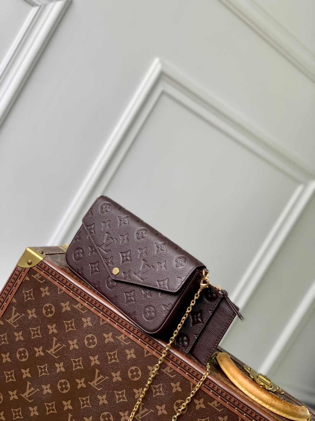 FÉLICIE POCHETTE 21 IN DARK BROWN MONOGRAM EMBOSSED LOGO CALFSKIN