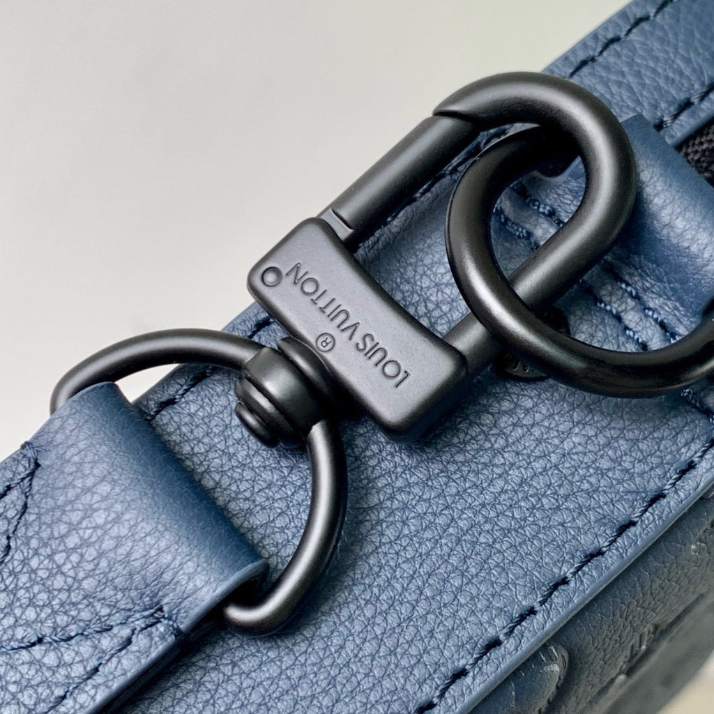TRIO MESSENGER 25 IN BLUE MONOGRAM SHADOW CALFSKIN