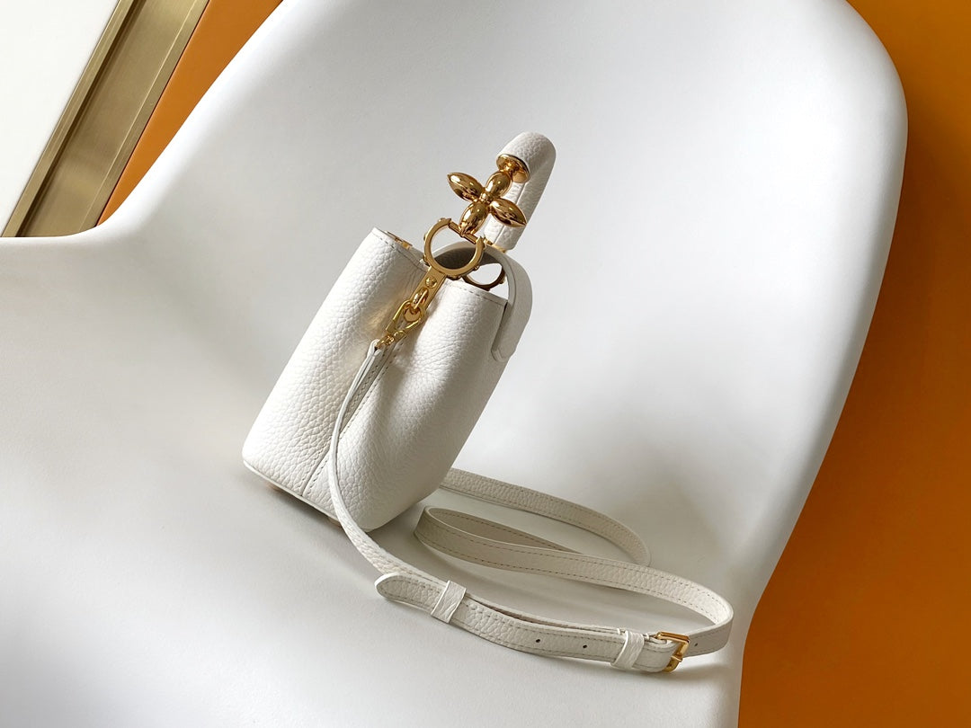 CAPUCINES EAST-WEST MINI 21 IN WHITE TAURILLON LEATHER GOLD-TONE HARDWARE