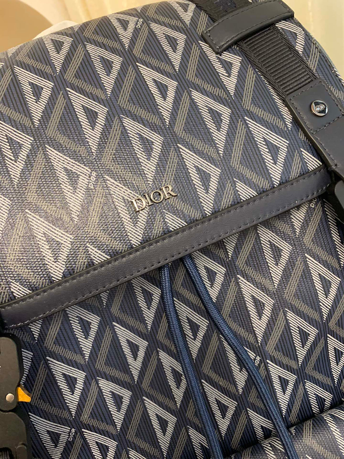 HIT THE ROAD BACKPACK WITH FLAP 51 IN WHITE AND BLUE TRIANGLE PATTERN FABRIC