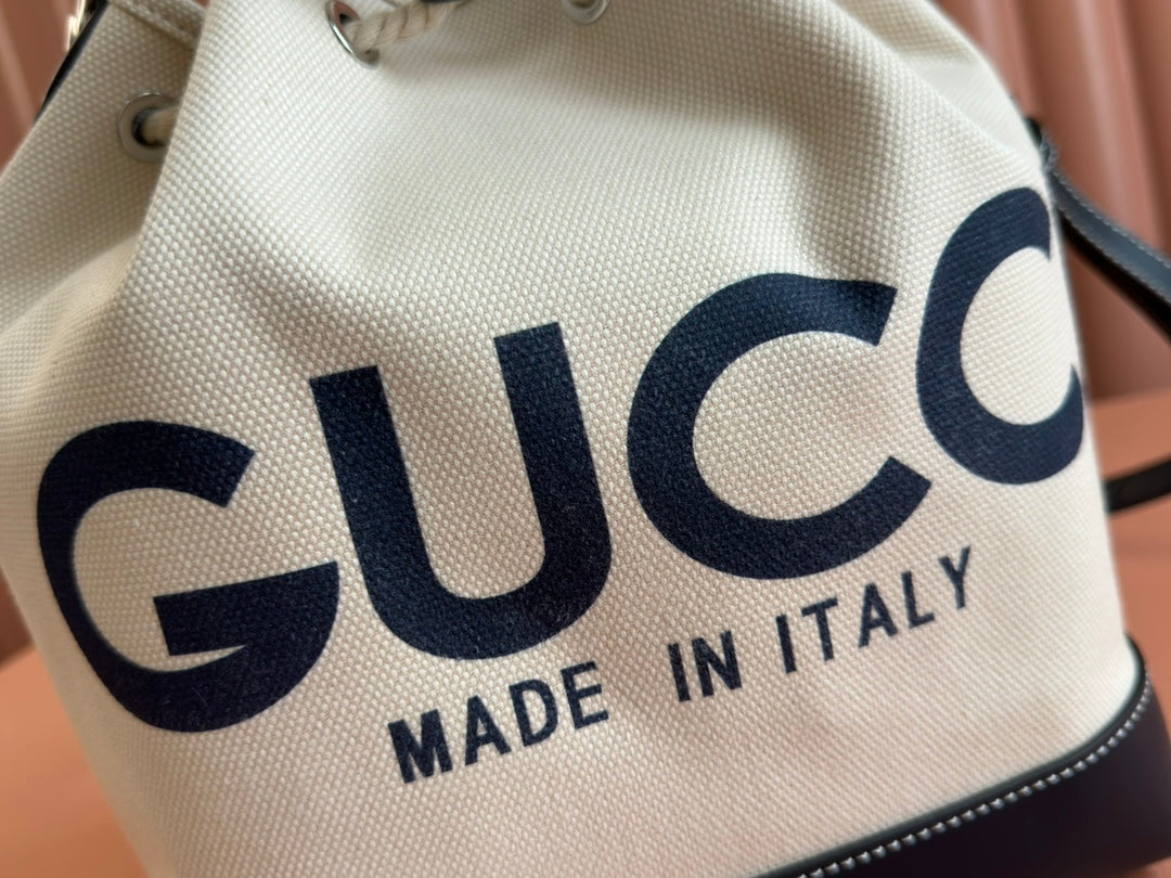 DRAWSTRING SHOULDER BAG LOGO PRINT 31 IN WHITE CANVAS DARK BLUE CALFSKIN